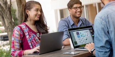 Colleagues working together on a laptop